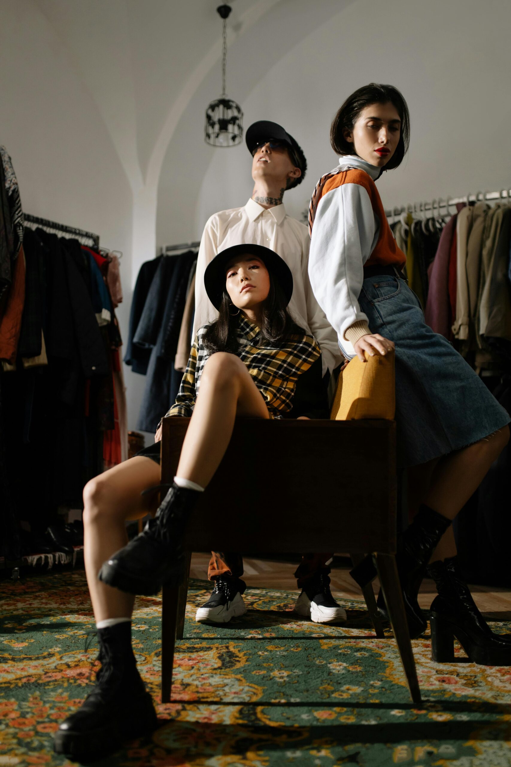 Stylish models posing in a vintage clothing store, showcasing individuality and fashion diversity.